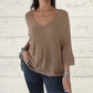 Top tricoté uni pour femme avec col en V et manches chauve-souris