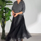 Ensemble 2 pièces pour femme composé d'un haut scintillant et d'une jupe en maille