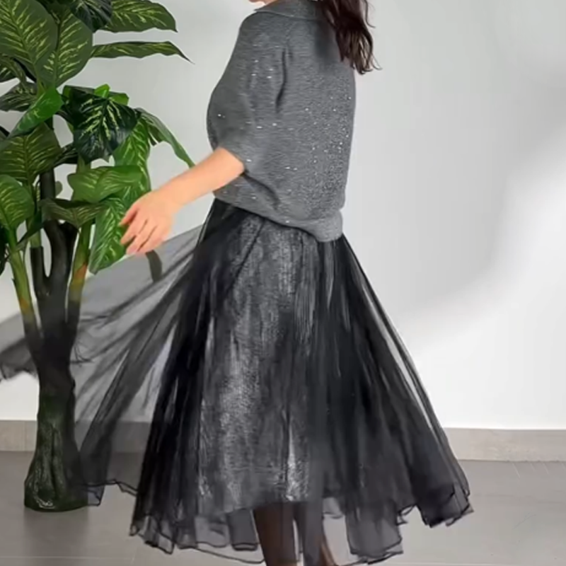 Ensemble 2 pièces pour femme composé d'un haut scintillant et d'une jupe en maille