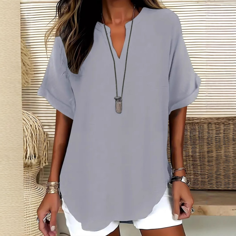 👚60 % DE RÉDUCTION ! 🔥Top ample à manches courtes tendance – Col en V cranté, ourlet asymétrique et tissu léger (5 couleurs, tailles S à 2XL) 🌸