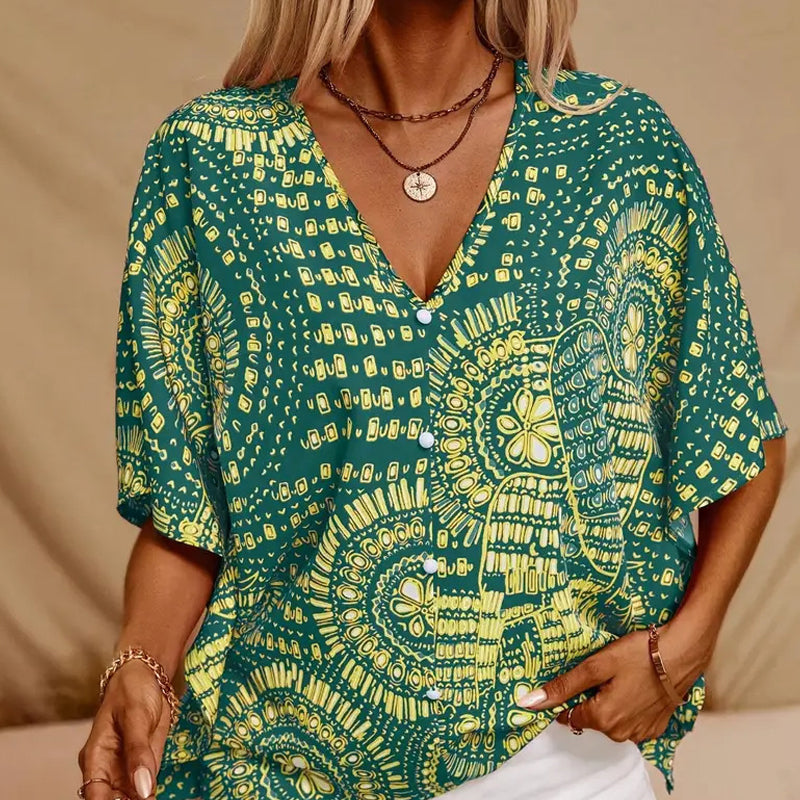👚 50% DE RÉDUCTION 🌸 Top imprimé col V, manches dolman – Coupe large & style vacances – Léger, fluide – parfait pour l’été ou les voyages – look bohème et confortable ☀️🌿✨