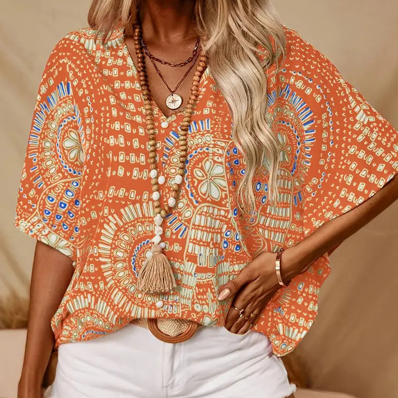 👚 50% DE RÉDUCTION 🌸 Top imprimé col V, manches dolman – Coupe large & style vacances – Léger, fluide – parfait pour l’été ou les voyages – look bohème et confortable ☀️🌿✨