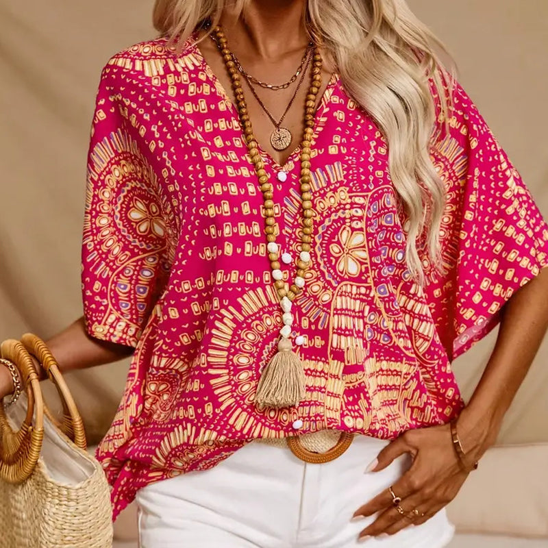👚 50% DE RÉDUCTION 🌸 Top imprimé col V, manches dolman – Coupe large & style vacances – Léger, fluide – parfait pour l’été ou les voyages – look bohème et confortable ☀️🌿✨