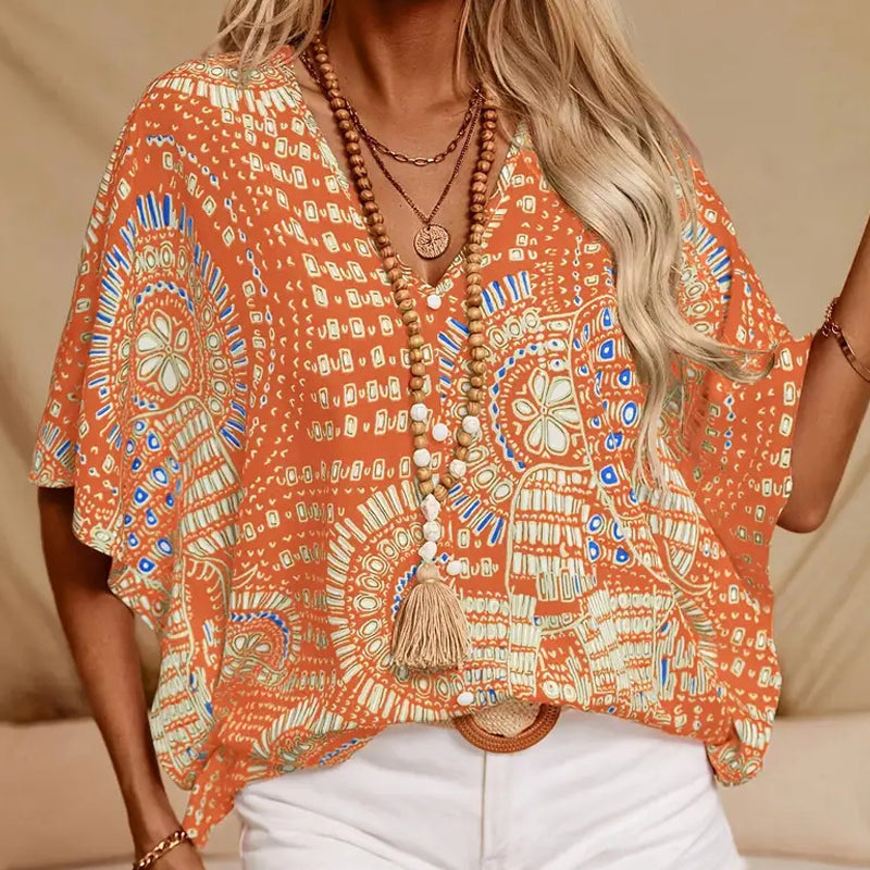 👚 50% DE RÉDUCTION 🌸 Top imprimé col V, manches dolman – Coupe large & style vacances – Léger, fluide – parfait pour l’été ou les voyages – look bohème et confortable ☀️🌿✨