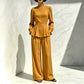 Ensemble élégant pour femme composé d'un haut à manches bouffantes et d'un pantalon à jambes larges